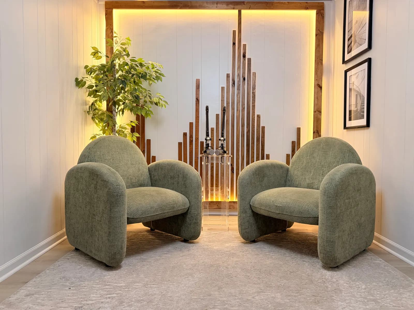 Bright symmetric view of the Neutral Room chairs and framed art